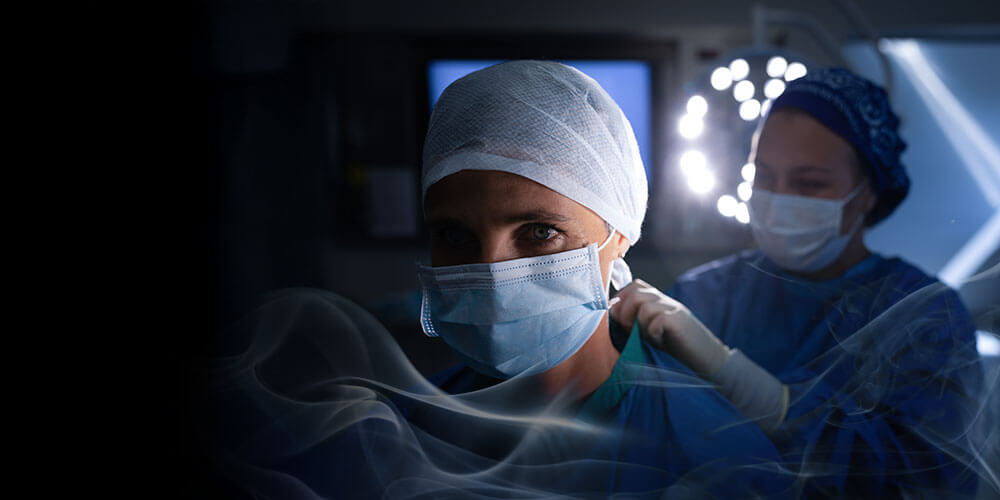Smoke overlay two women in surgical setting